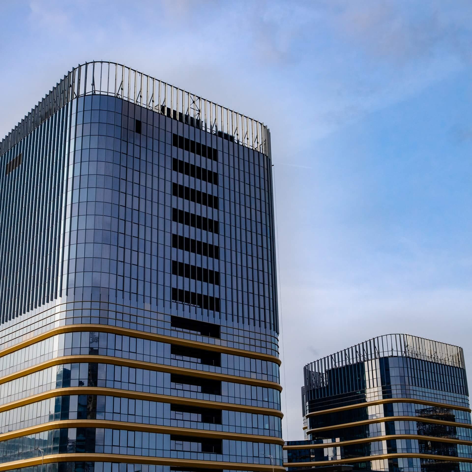 Exterior of corporate buildings symbolizing spring cleaning tips for your office